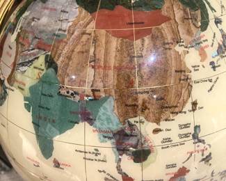 Gemstone globe on brass floor stand