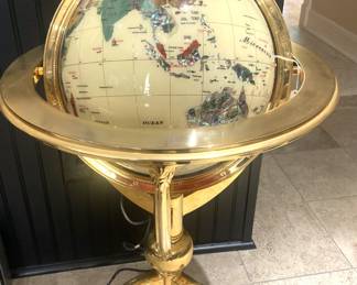 Gemstone globe on brass floor stand