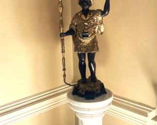 One of two highly desired blackamoor statues with marble columns.