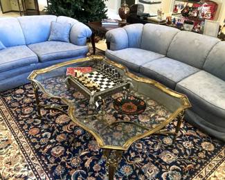 Blue sofa and matching settee; large glass and brass coffee table