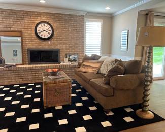 Rustic Silver Floor Lamp, Henredon corduroy style couch,  Grandinroad black & white area rug, Vtg wicker trunk coffee table, William Sonoma Wall Clock