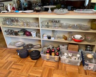 On top of the shelves a couple of crystal serving platter and bowl.  