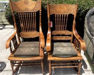 Close up of carved wooden rocking chairs