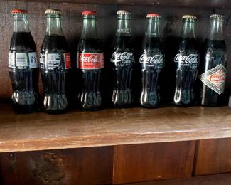 Old Coca-Cola Bottles from different events