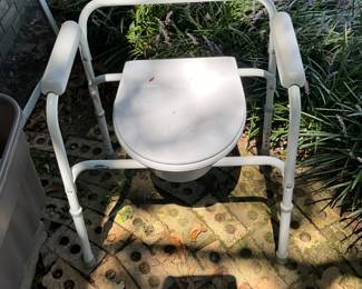 Outdoors in back of the house - Commode chair