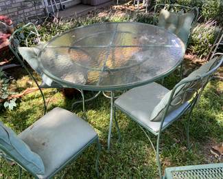 Outdoors in back of the house - Patio table & four chairs with cushions