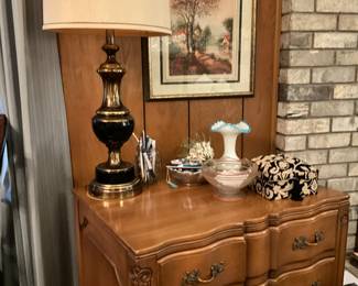 Small curved front chest, lamp, decor, picture