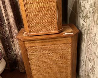 There are two solid wood trash cans, one hamper and one tissue holder