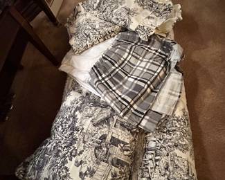 Add the bed ruffle and two pillow shams