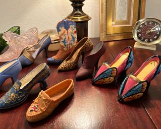 The two colorful slippers are salt/pepper shakers
Others are “If the Shoe Fits.” Some have boxes