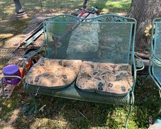 Outdoors in back of the house - Metal bench