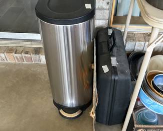 Briefcase, garbage can