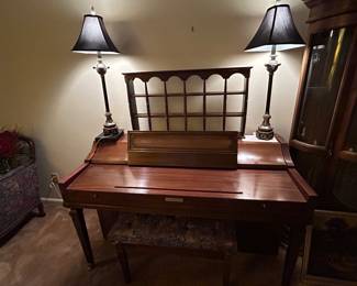 Baldwin Piano with two buffet lamps and display shelf