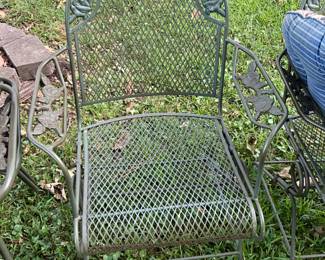Outdoors in back of the house - metal chair