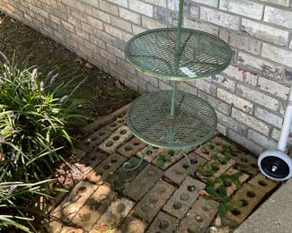 Outdoors in back of the house - Tiered metal table