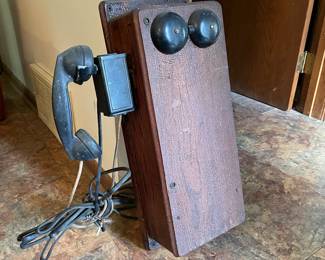 Antique wall phone.  Has all wiring and guts. Heavy