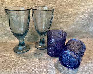 Noritake blue "Sweet Swirl" water goblets and Godinger blue whiskey glasses