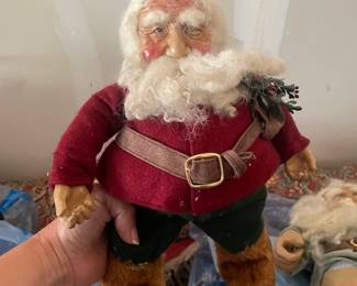 Lots of vintage folk art Santa’s 