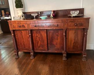 Empire style flame mahogany sideboard with large claw feet
