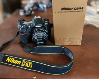 Digital camera w/ new battery & small lens $200.
Nikkor lens zoom, 18-200mm- $500