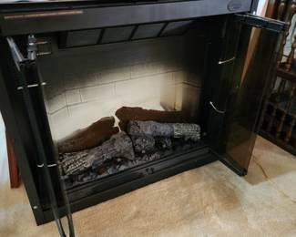 Electric fireplace insert.  Brand new. 1/2 price. $700. Dimplex model DF3215. 1500watts.  31.5 tall x 36 wide x 13 deep