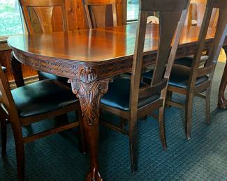 HEAVILY CARVED LEGS ON THIS MAHOGANY TABLE