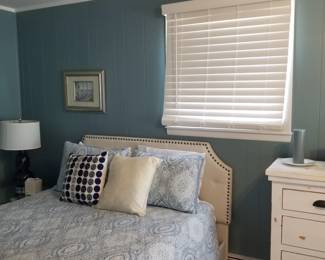 Queen bed with upholstered frame; blinds