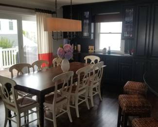 Dining set seats 8; contemporary light fixture