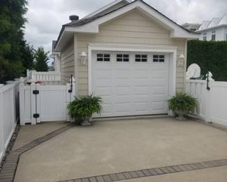 Garage door; potted ferns