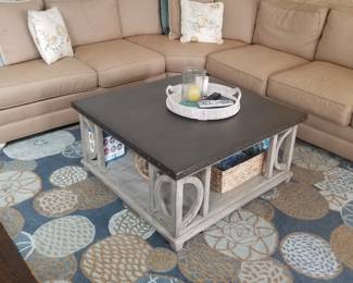 Statement coffee table; contemporary rug