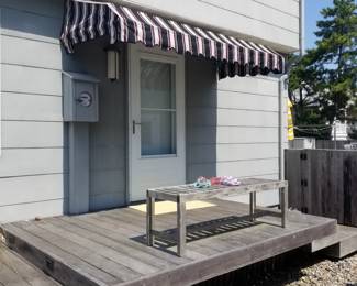 Fixed awning; bench