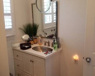 Updated bath vanity; stylish vanity mirror