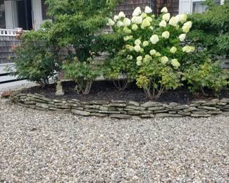 Slate pieces; plantings; stones