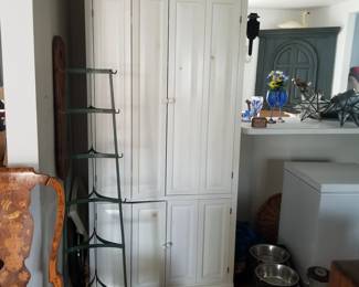 Pot tower - shown empty; white cupboard