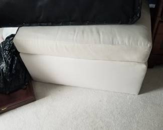 Contemporary cream ottoman matches sectional couch