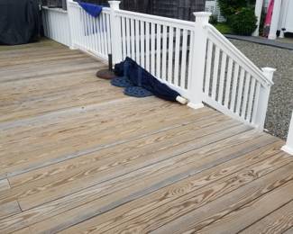 Nearly new wood decking; vinyl railing