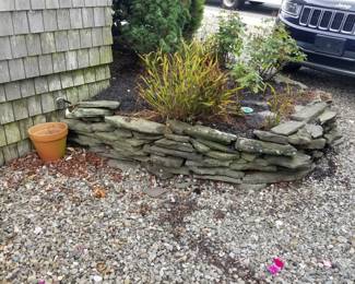Slate pieces; plantings; stones