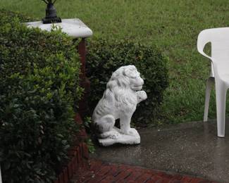 ONE OF TWO CONCRETE LIONS