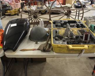HARLEY GAS TANK, ARMY STEEL POT, TWO VINTAGE WAGON WHEELS IN BACKGROUND