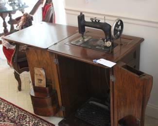 1890’S NEW HOME  CABINET SEWING MACHINE WITH ORIGINAL OWNERS MANUEL