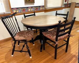 How cute is this smaller pedestal table? It has four matching chairs like the three shown. 
