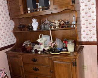 This buffet with plate rails offers display space and places to put some items out of the way.  It could also be repurposed into a coffee bar or kitchen cabinet. 