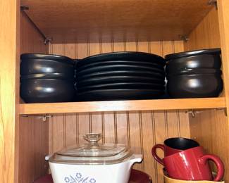 Corelle is popular in this kitchen. Here, a set of cinnamon red over black dishes. Also shown are the popular Blue Cornflower casserole and a set of black crocks ideal for French onion soup. 