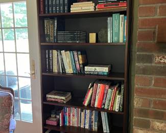 1 of 2 bookcases with brass lighting
