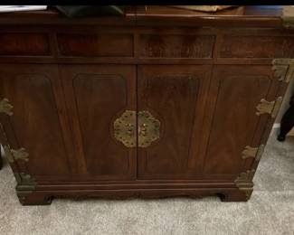 Asian wood and brass server with movable shelf with hidden wheels 
