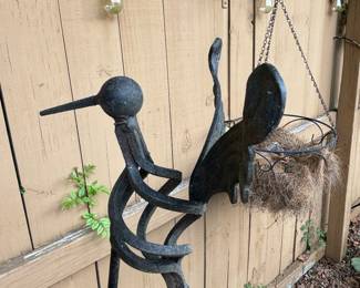 Iron bird stake, girl skipping rope 