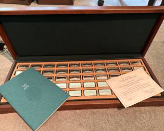 Collection of ship ingots with booklet