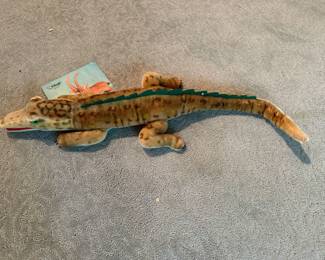 Stiff alligator with button