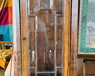 German case refinished; circa 1910-20; beveled and leaded glass; two access doors; gorgeous clock in very good working order