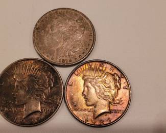 One Morgan and two Peace silver dollars